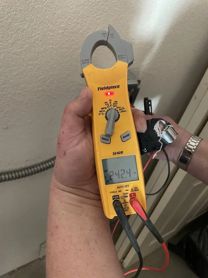 Voltage testing with clamp meter during Circuit Breaker Repair in Belmont